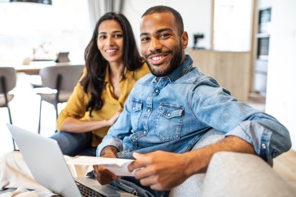 Couple on couch with computer